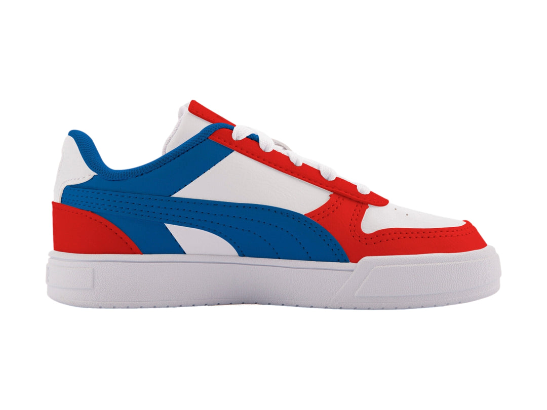 Tenis PUMA Caven Dime PS para niños en colores blanco, azul y rojo con suela blanca.