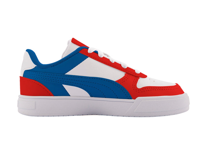 Tenis PUMA Caven Dime PS para niños en colores blanco, azul y rojo con suela blanca.