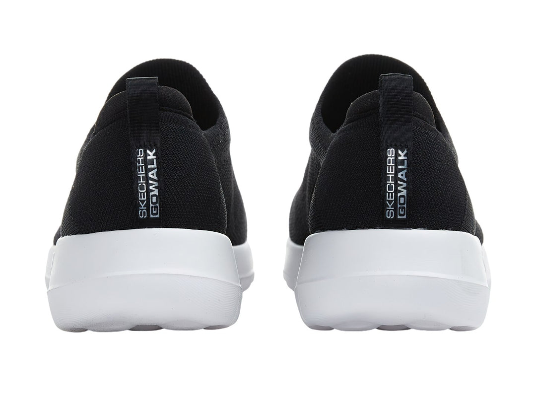 Tenis Skechers Go Walk Joy color negro con suela blanca, estilo slip-on de tela tejida.