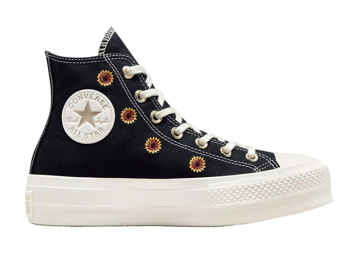 Tenis Converse Chuck Taylor All Star Lift HI color negro con bordados de flores doradas y suela blanca.