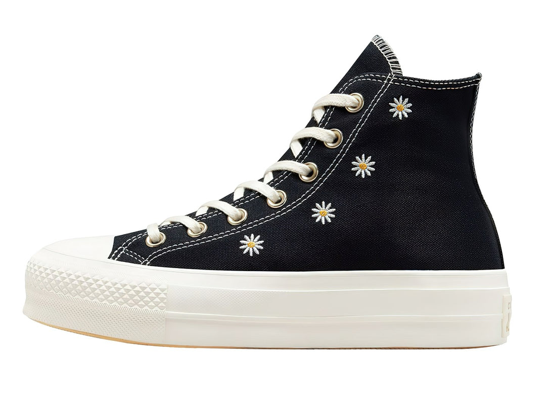 Tenis Converse Chuck Taylor All Star Lift HI color negro con bordados de flores doradas y suela blanca.