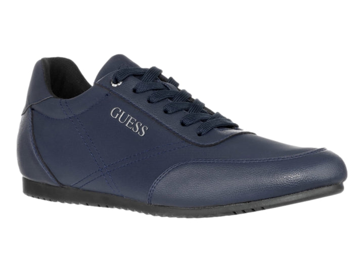 Tenis casuales de color azul marino marca Guess con cordones y suela oscura.