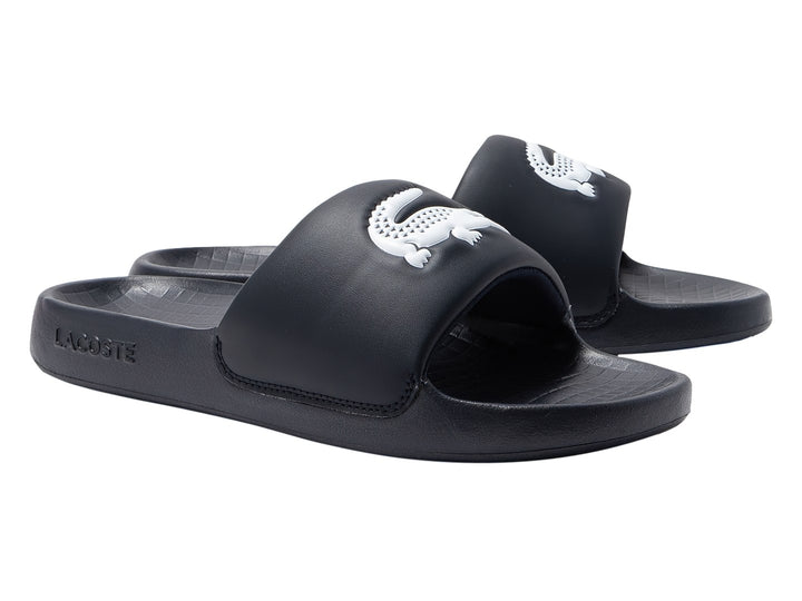 Sandalia tipo slide de color navy con logo blanco en la banda superior.