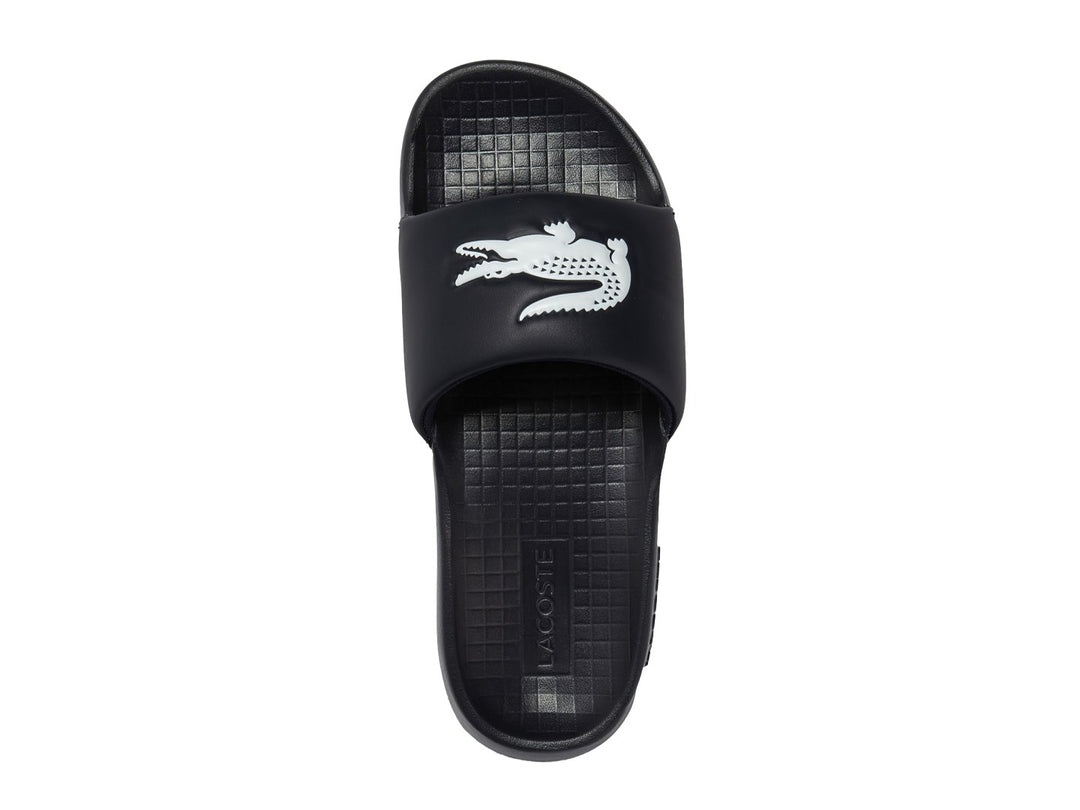 Sandalia tipo slide de color navy con logo blanco en la banda superior.