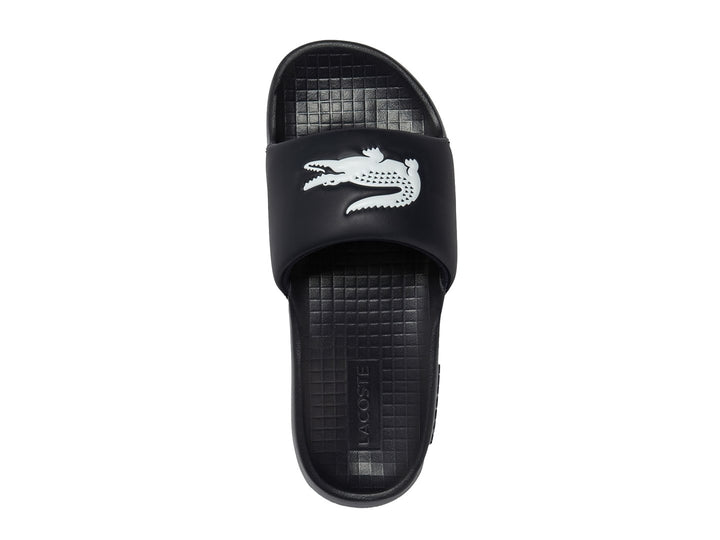 Sandalia tipo slide de color navy con logo blanco en la banda superior.