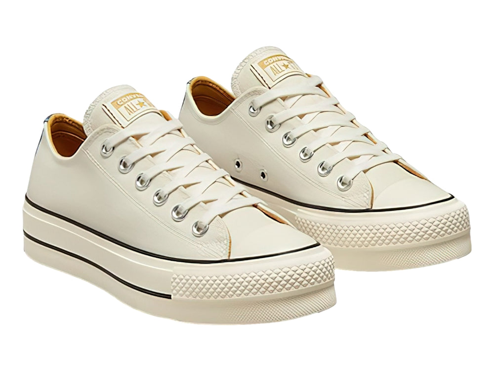 Tenis Converse Chuck Taylor All Star Lift color blanco roto con suela de plataforma y detalles en azul marino.