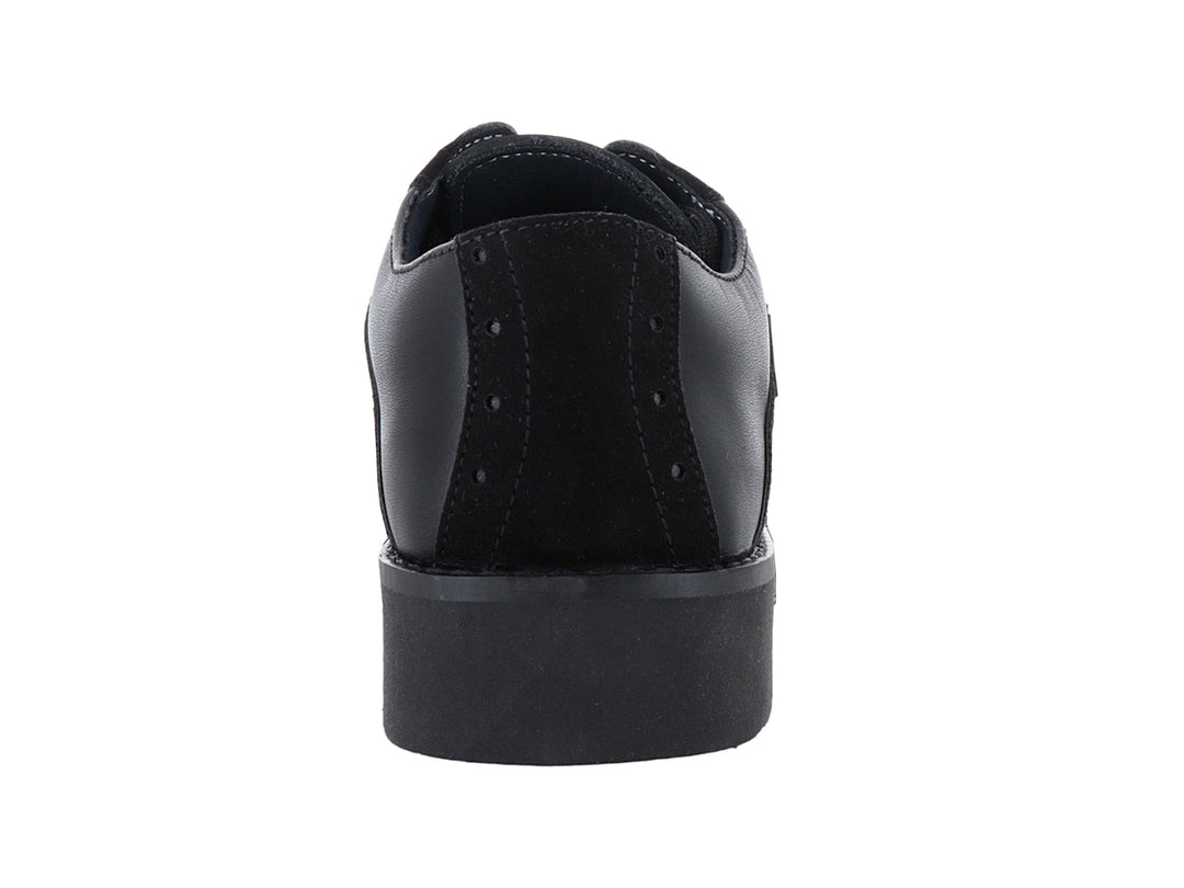 Zapato infantil negro YUYIN con combinación de texturas napa y nobuck y cierre de agujetas.