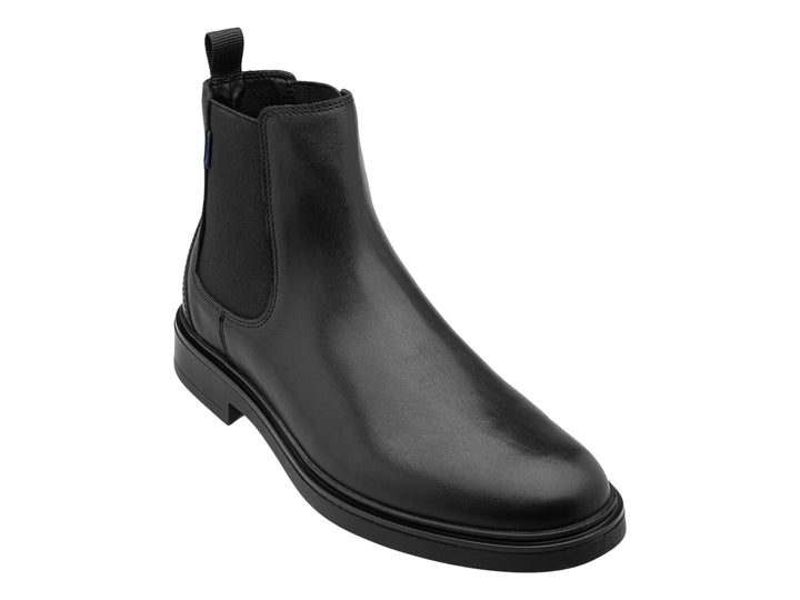 Botín negro estilo Chelsea de cuero con panel elástico lateral.