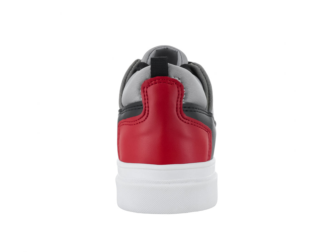 Tenis infantiles en colores blanco, gris y negro con detalles en rojo y suela blanca.