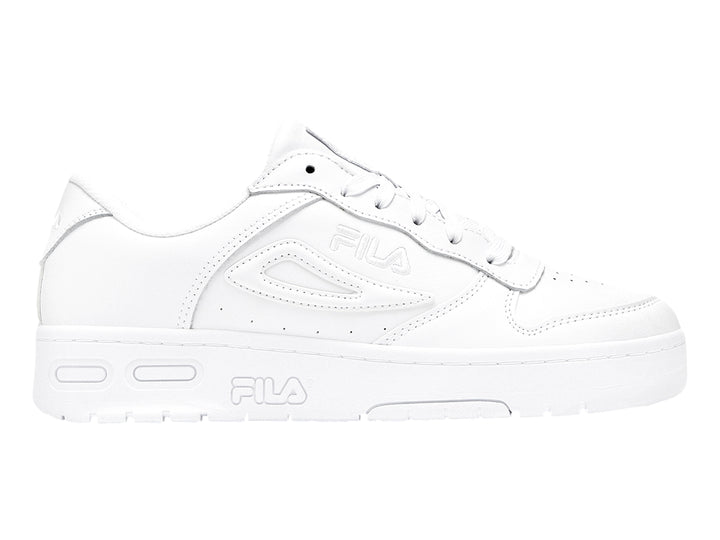 Tenis deportivos FILA para niño en color blanco total con suela ancha y detalles en relieve.