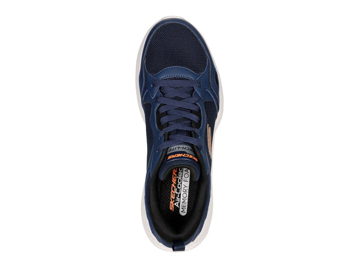 Tenis deportivos Skech-Lite Pro en color azul marino con suela blanca y detalles en naranja.