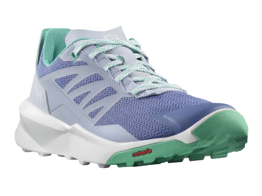 Tenis deportivos Salomon en color morado con suela blanca y detalles en verde.
