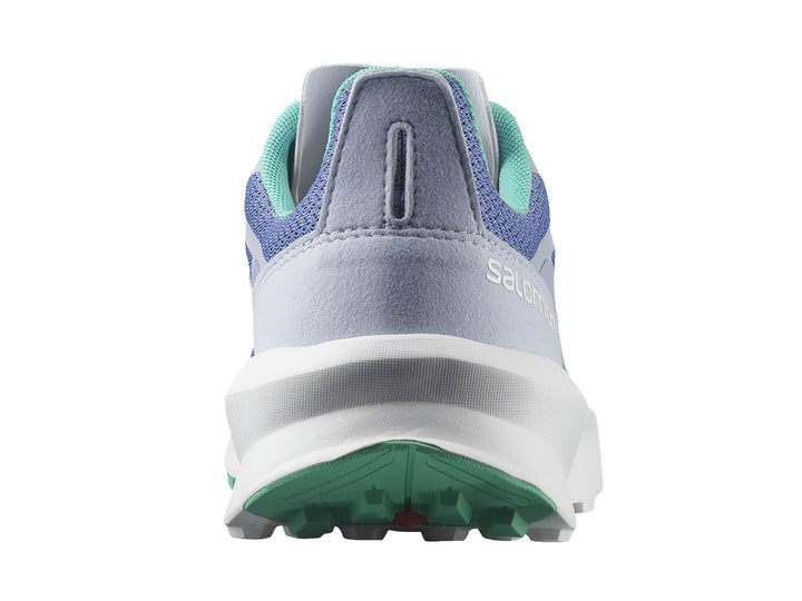 Tenis deportivos Salomon en color morado con suela blanca y detalles en verde.
