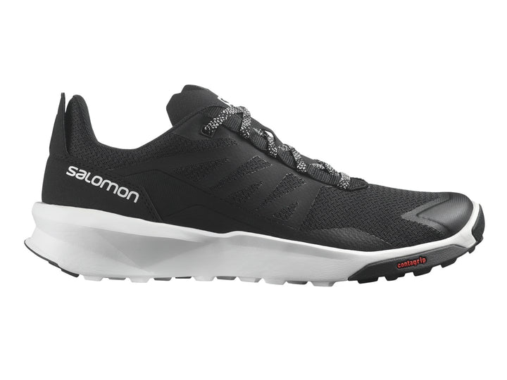 Tenis deportivos Salomon de color negro con suela blanca y detalles en rojo.