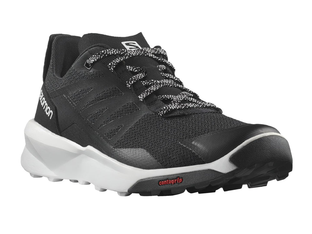 Tenis deportivos Salomon de color negro con suela blanca y detalles en rojo.