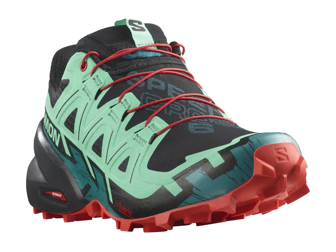 Tenis Salomon Speedcross 6 en colores azul, negro y rojo con suela agresiva para trail running.