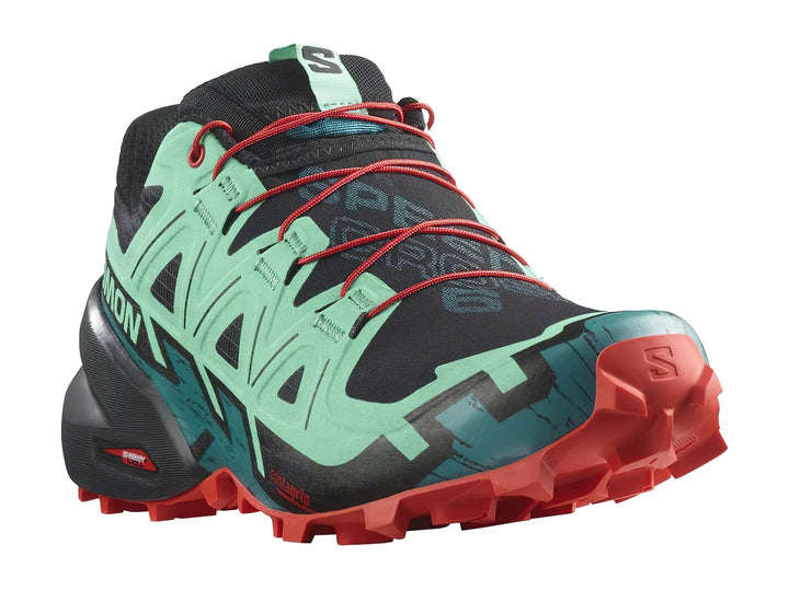 Tenis Salomon Speedcross 6 en colores azul, negro y rojo con suela agresiva para trail running.