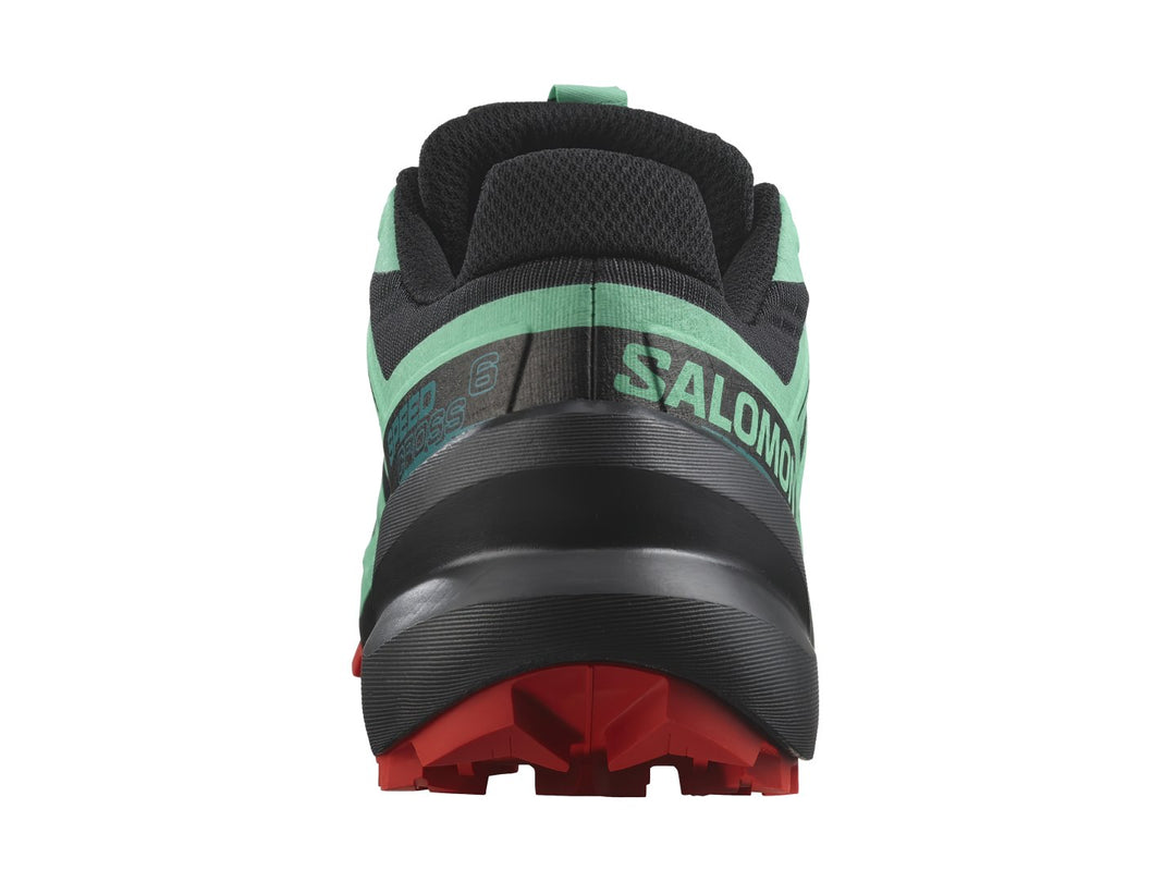 Tenis Salomon Speedcross 6 en colores azul, negro y rojo con suela agresiva para trail running.