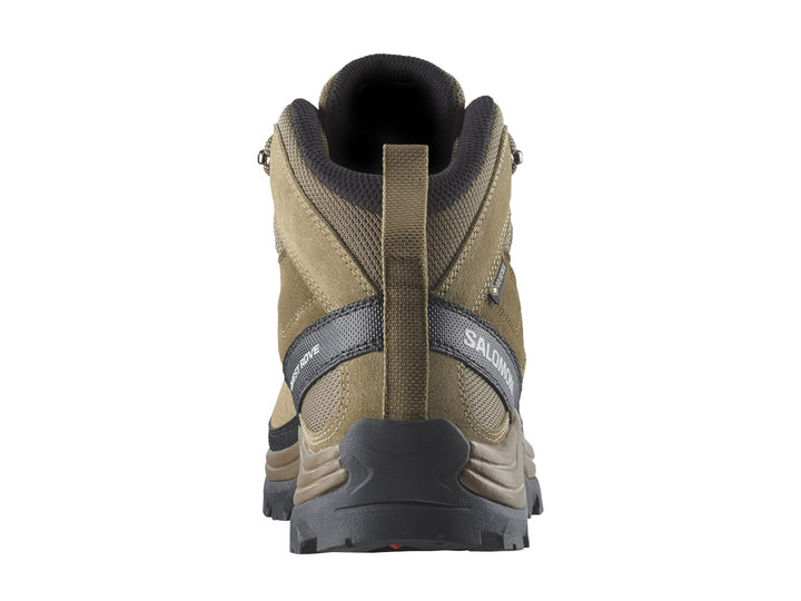 Bota de senderismo Salomon Quest Rove GTX color café con suela negra y detalles técnicos.