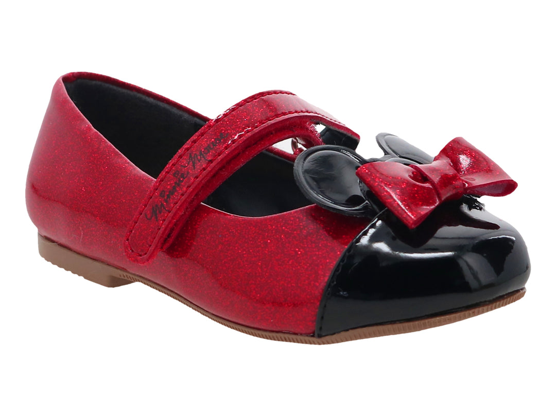 Zapato rojo brillante para niña con punta negra y moño decorativo en la parte superior.