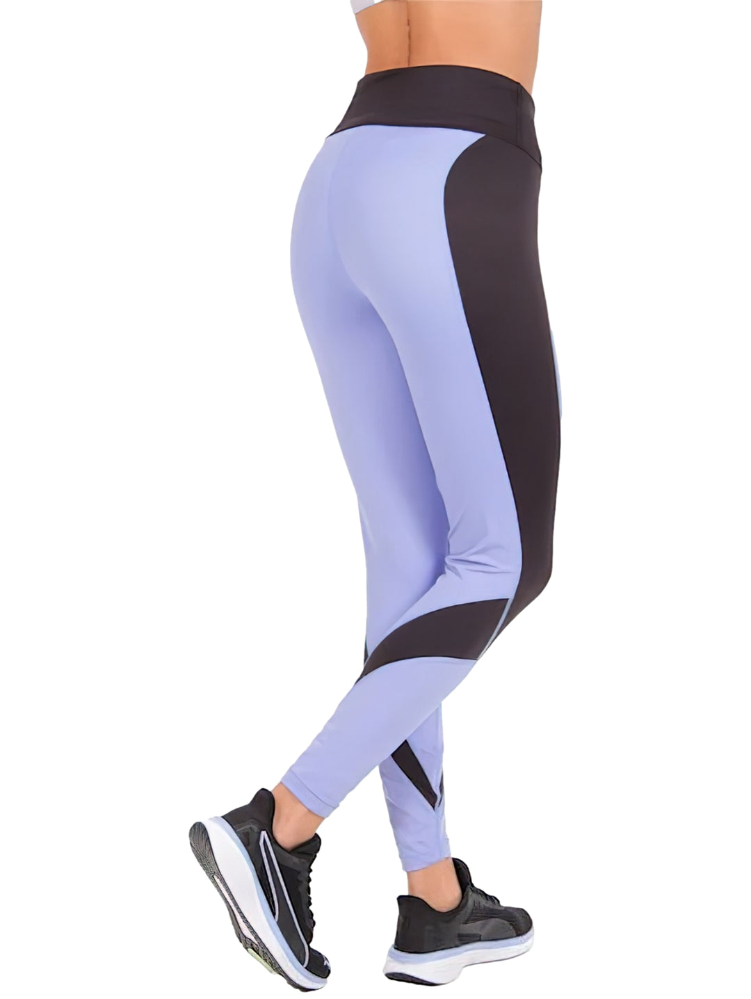 Leggings deportivos PUMA color morado con paneles negros, cintura alta y corte 7/8.