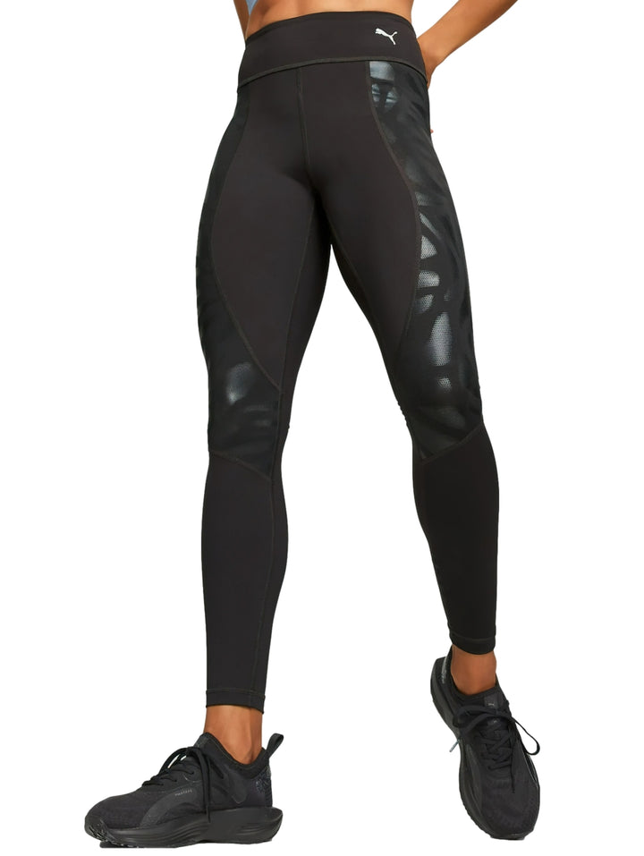 Leggings deportivos PUMA color negro de cintura alta con detalles brillantes laterales.