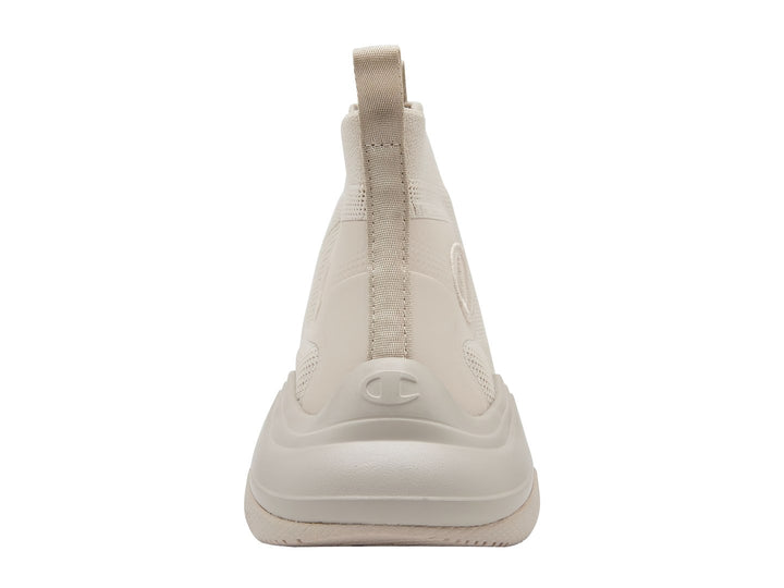 Tenis Champion color beige con suela gruesa y diseño tipo calcetín.