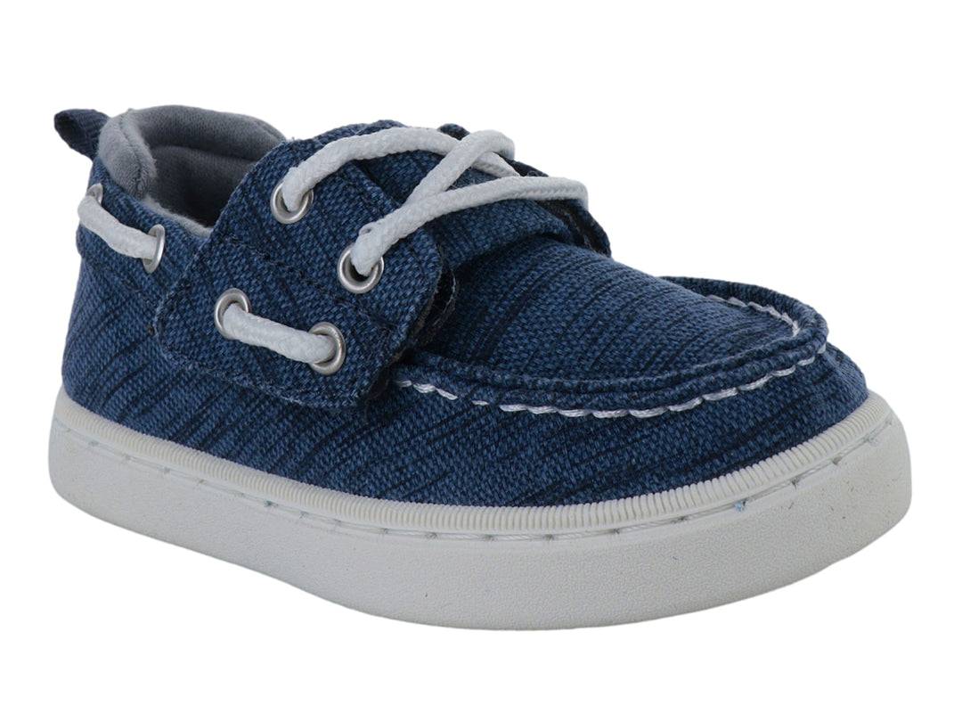 Zapato náutico infantil Sperry color azul con suela blanca y agujetas blancas.