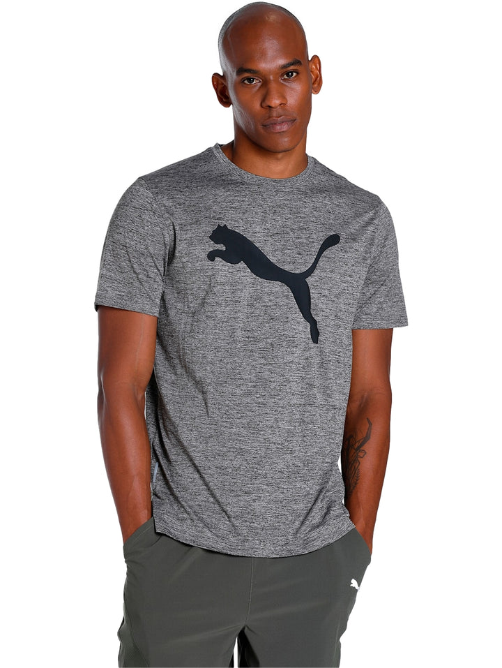 Camiseta deportiva PUMA color gris jaspeado con logotipo negro en el pecho.