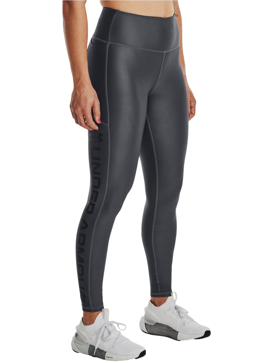 Leggings deportivos Under Armour color gris oscuro ajustados al cuerpo.