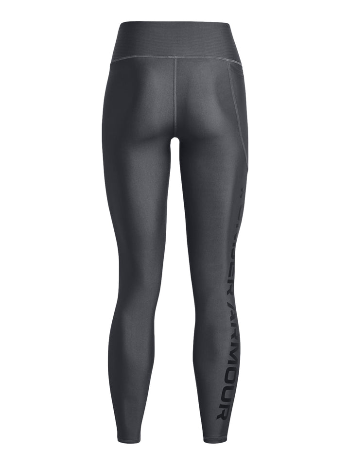 Leggings deportivos Under Armour color gris oscuro ajustados al cuerpo.