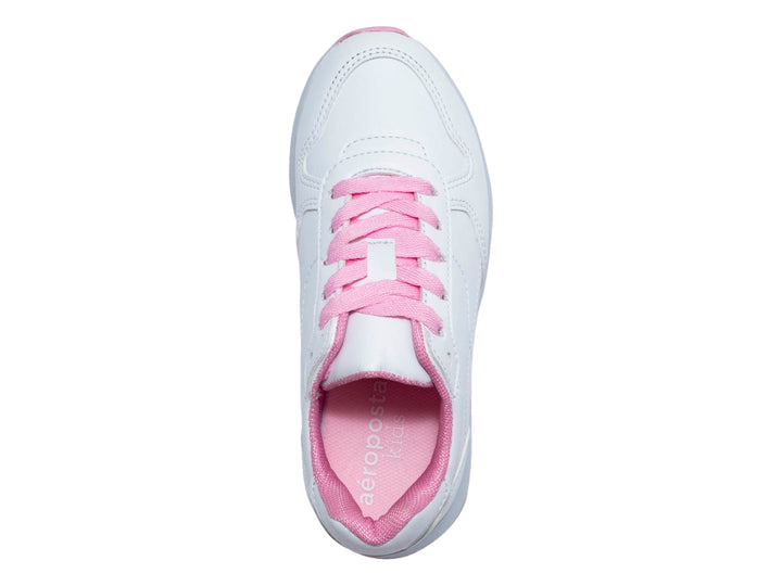 Tenis blancos para niña con cordones y suela de color rosa.