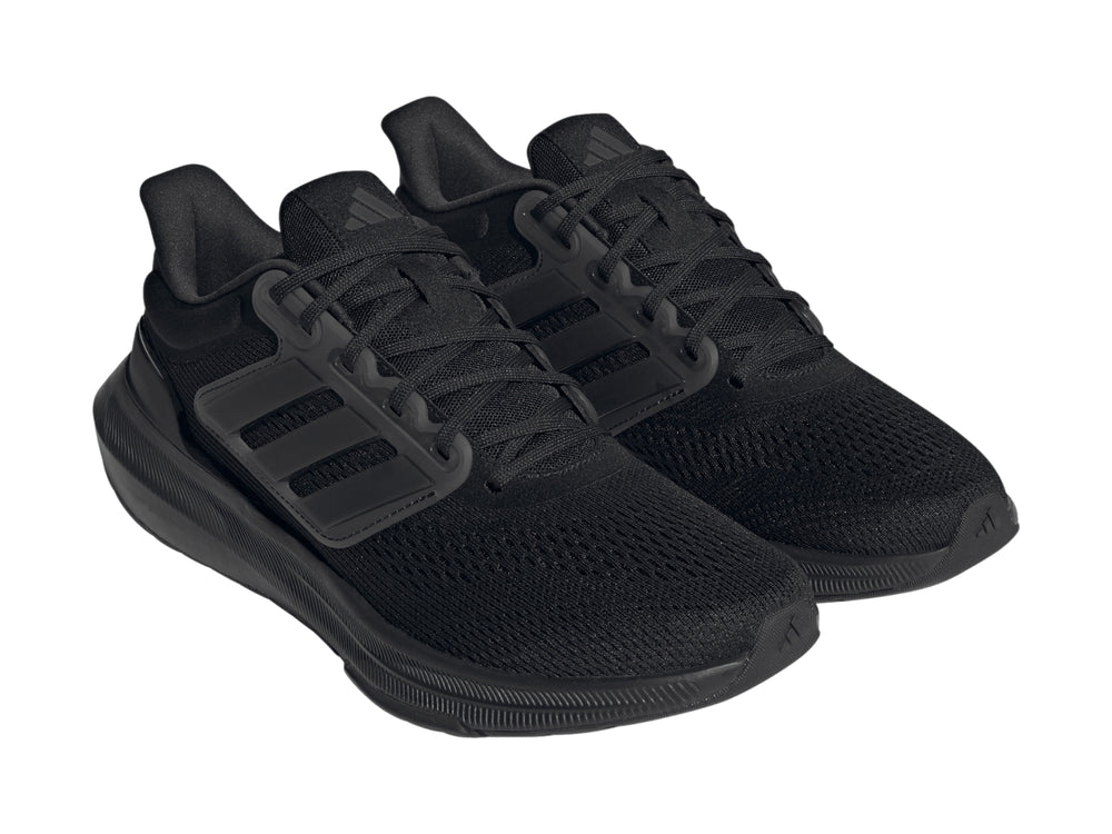 Tenis deportivos Adidas Ultrabounce en color negro total con suela gruesa y tejido transpirable.