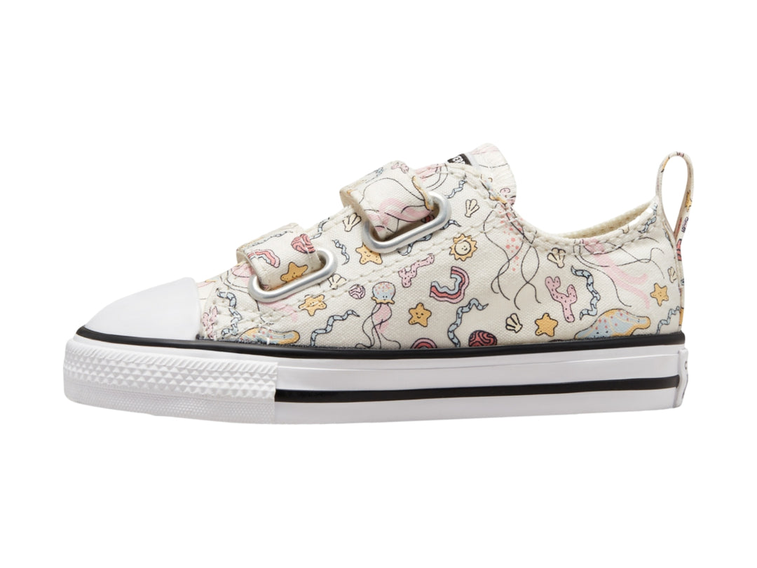 Tenis Converse blancos para Niño con estampado de criaturas marinas y cierre de velcro.