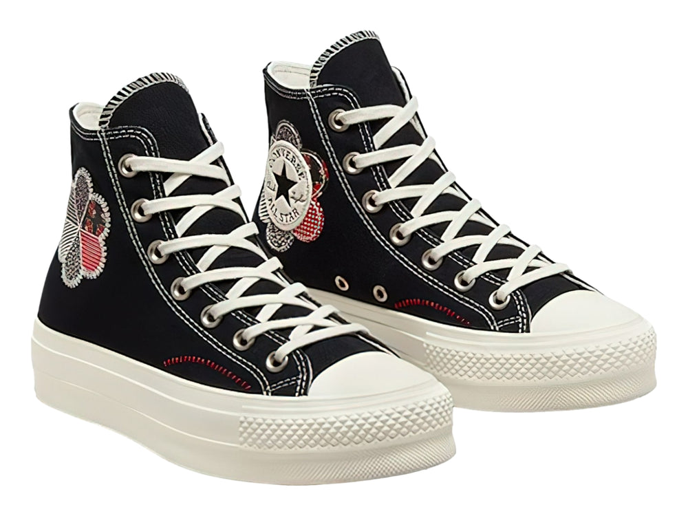 Tenis Converse Chuck Taylor All Star Lift HI color negro con suela de plataforma blanca y detalle floral lateral.