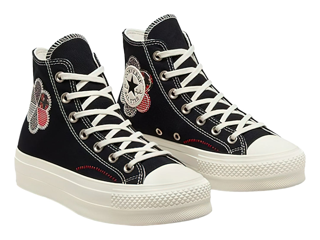 Tenis Converse Chuck Taylor All Star Lift HI color negro con suela de plataforma blanca y detalle floral lateral.