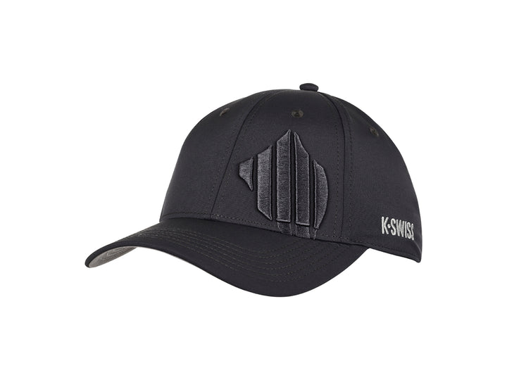 Gorra deportiva K-Swiss en color gris oscuro con logotipo frontal en relieve y visera curva.