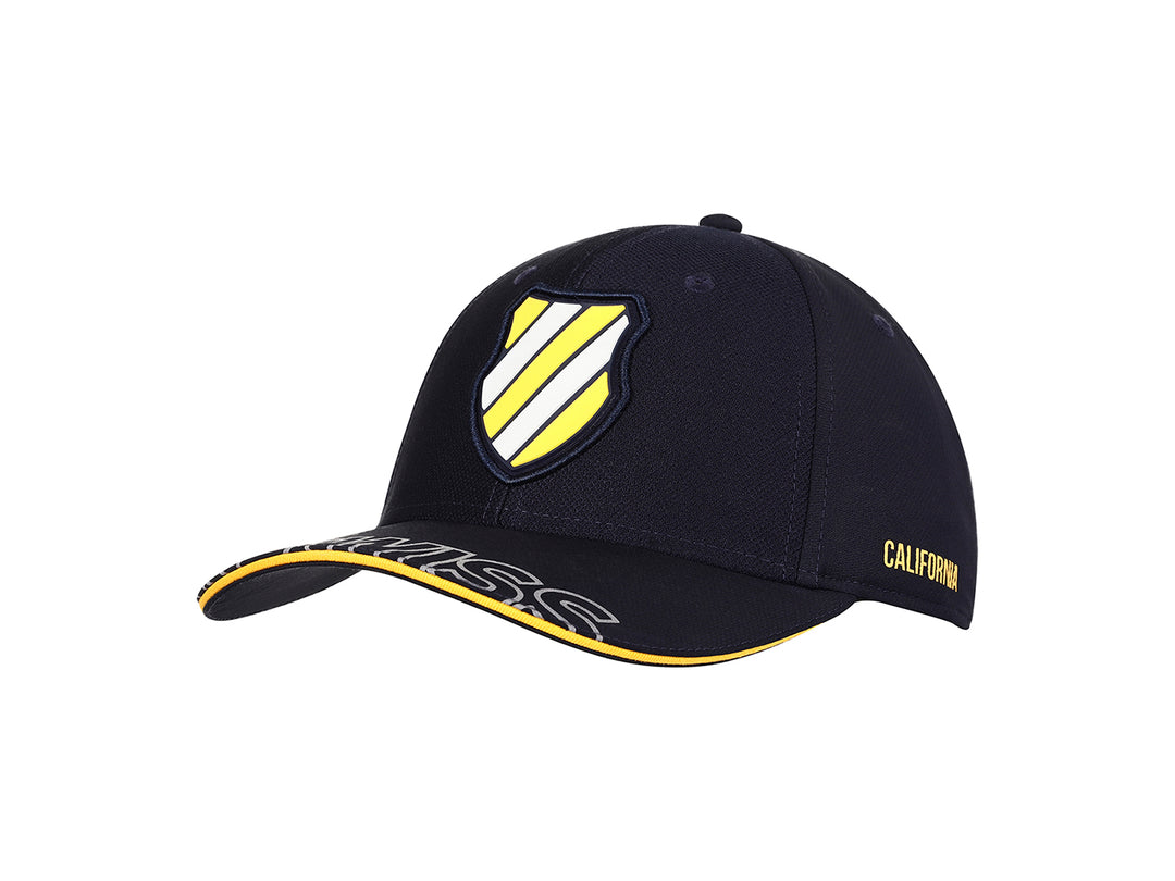Gorra K-Swiss color marino con visera curva, detalles en amarillo y logotipo frontal.