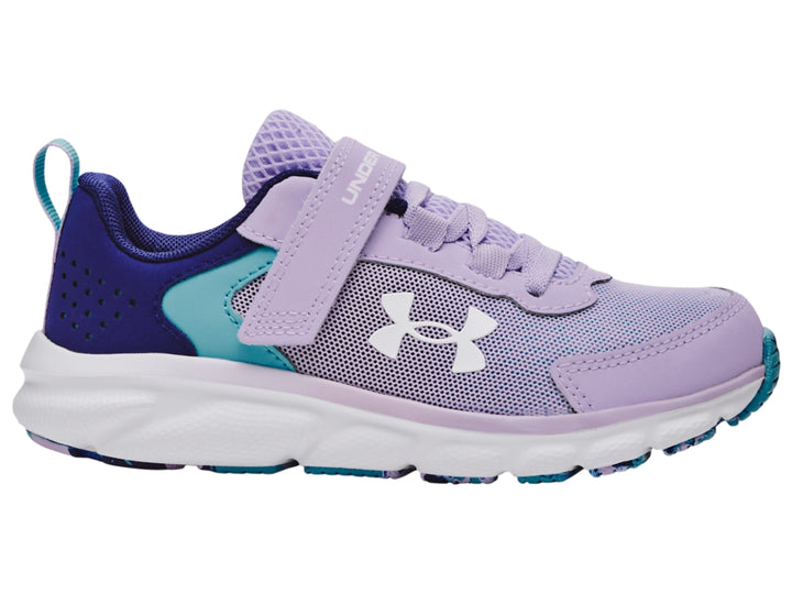 Tenis deportivos Under Armour para niña en color morado con detalles azules y suela blanca.
