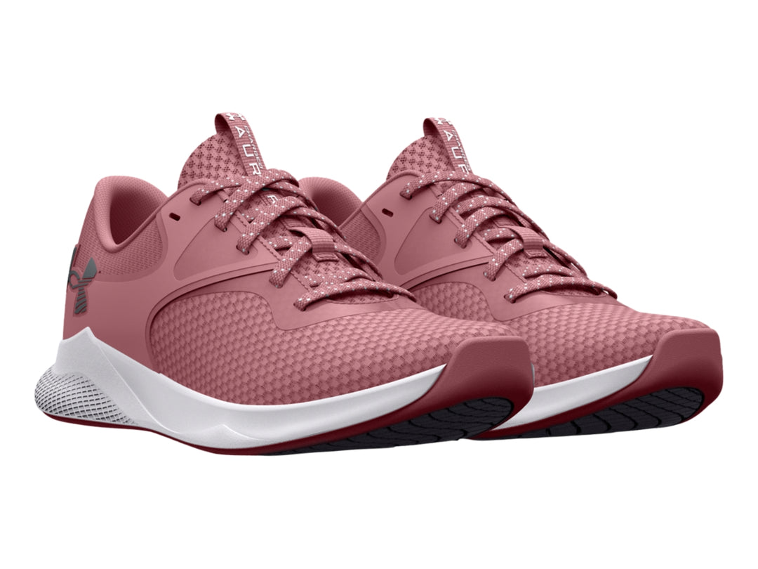 Zapatilla deportiva Under Armour Charged Aurora 2 en color rosa con suela blanca.