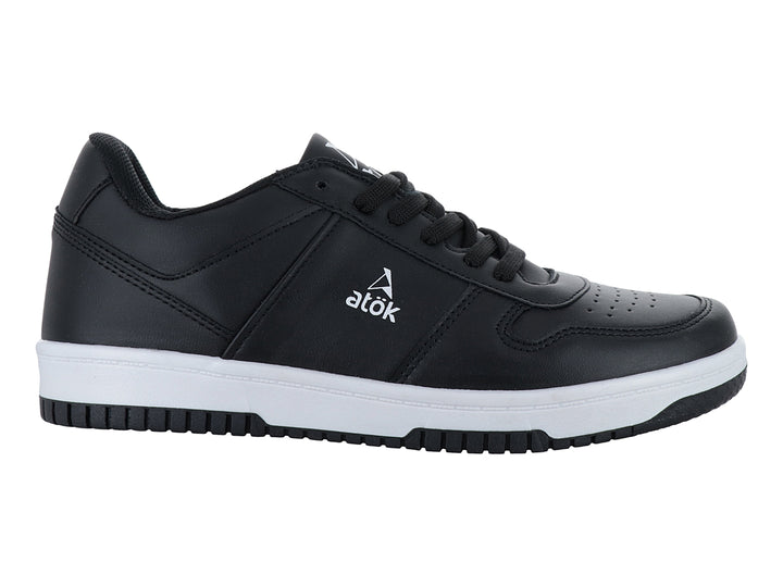 Tenis ATOK color negro con suela blanca y agujetas negras, vista lateral sobre fondo blanco.