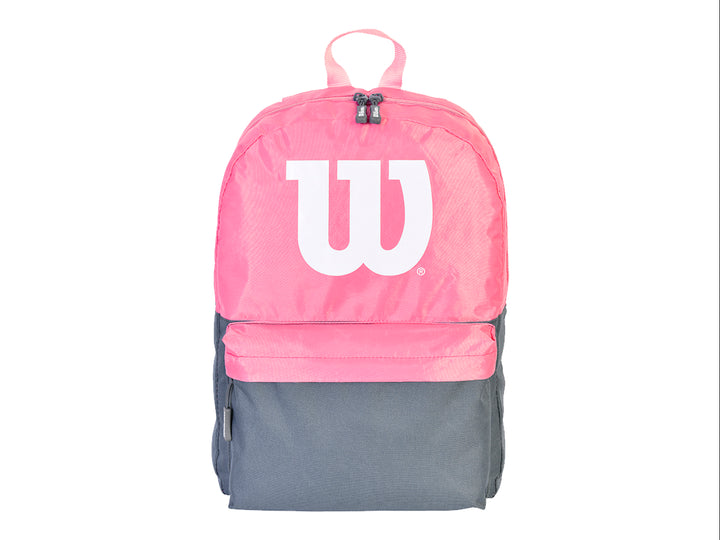 Mochila deportiva Wilson en colores rosa y negro con logotipo blanco frontal.