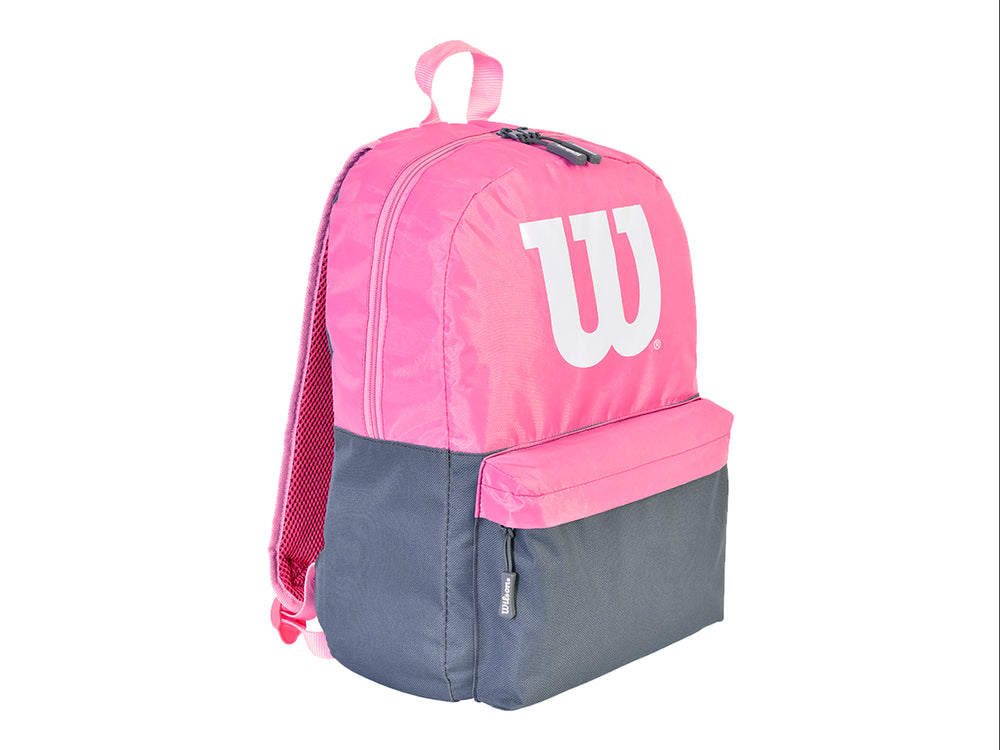 Mochila deportiva Wilson en colores rosa y negro con logotipo blanco frontal.