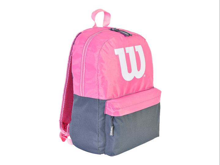 Mochila deportiva Wilson en colores rosa y negro con logotipo blanco frontal.