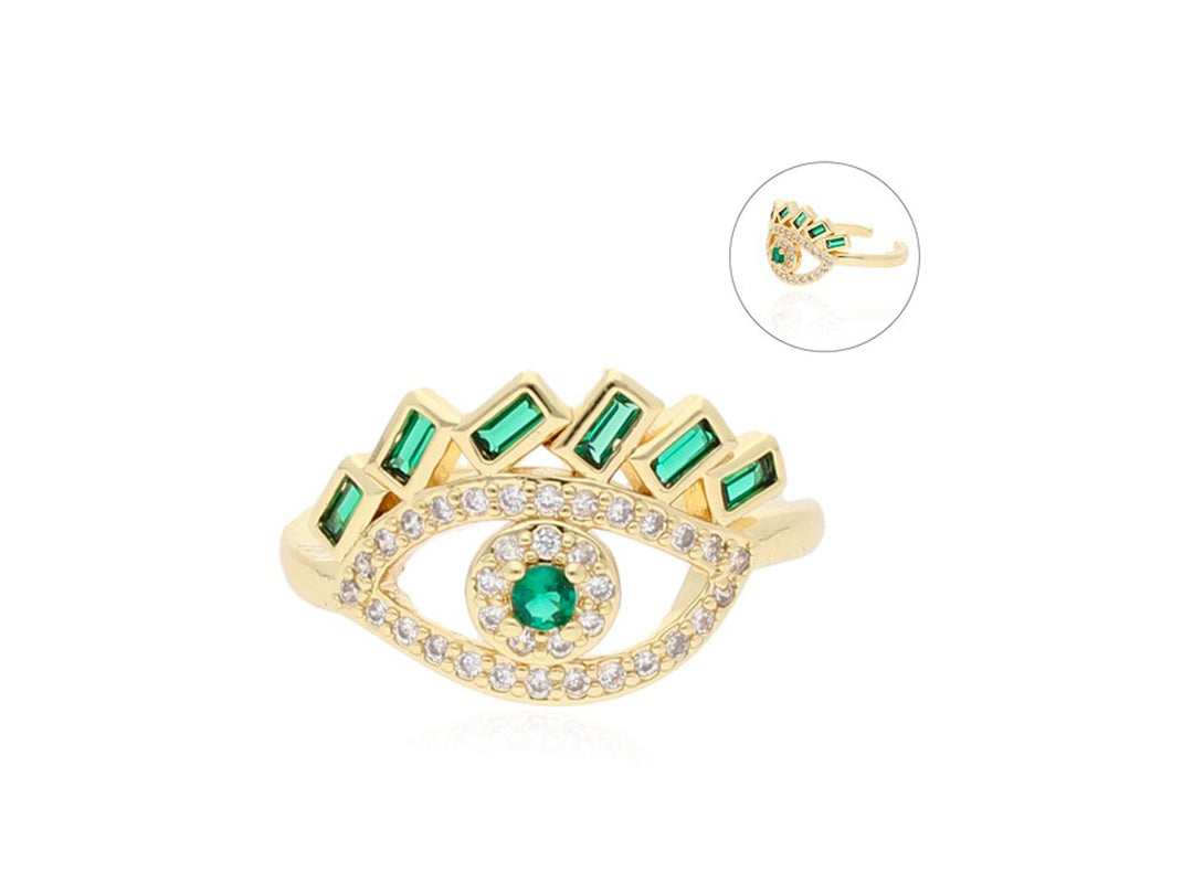 Anillo dorado con diseño de ojo, adornado con piedras verdes y pequeñas circonias blancas.
