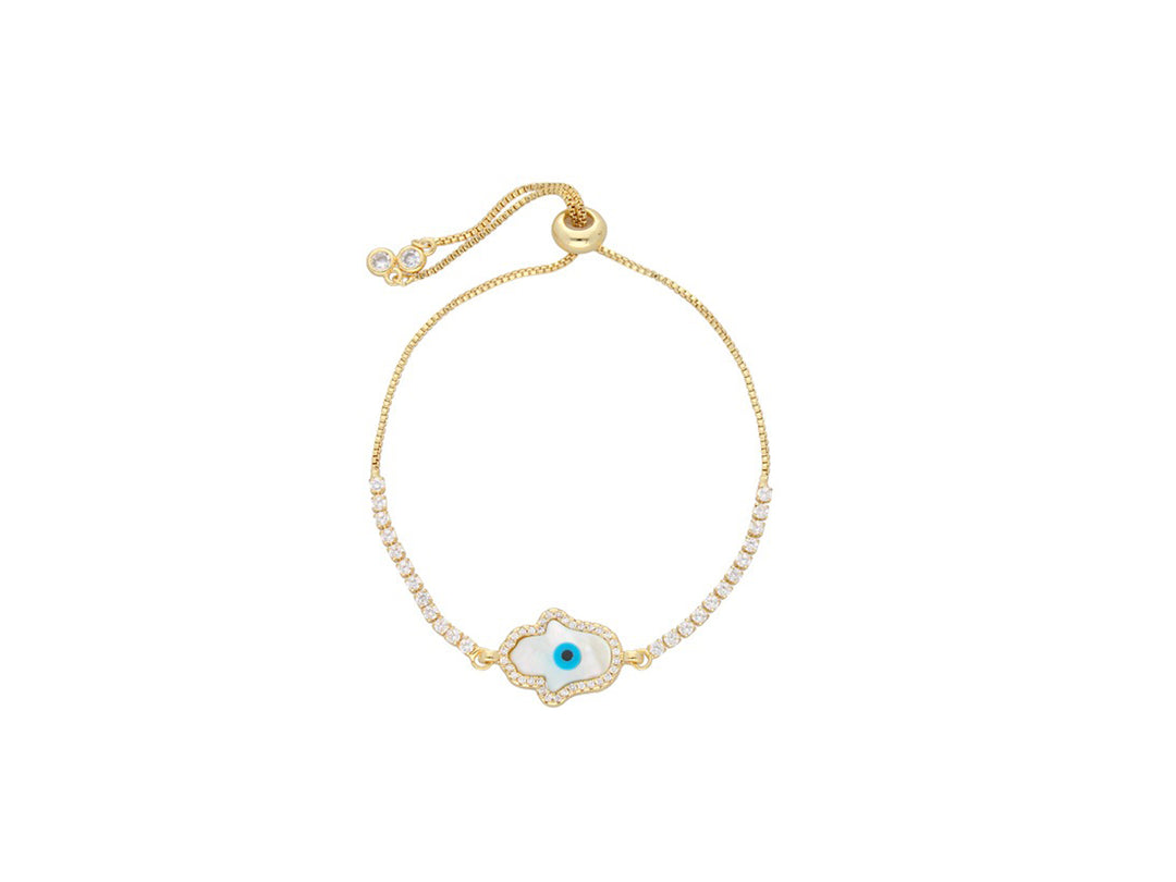 Pulsera de oro con dije central de ojo turco en blanco y azul, adornada con brillantes y cierre ajustable.