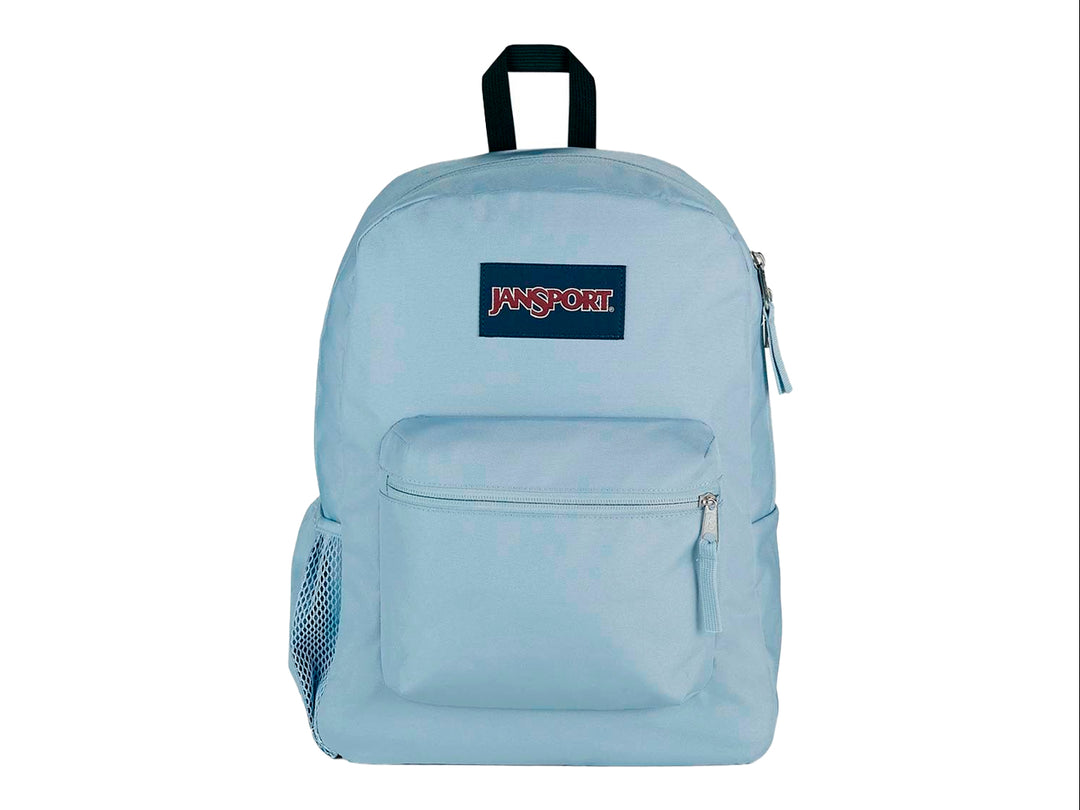 Mochila JanSport modelo Cross Town en color azul dusk con un bolsillo frontal y asa superior negra.