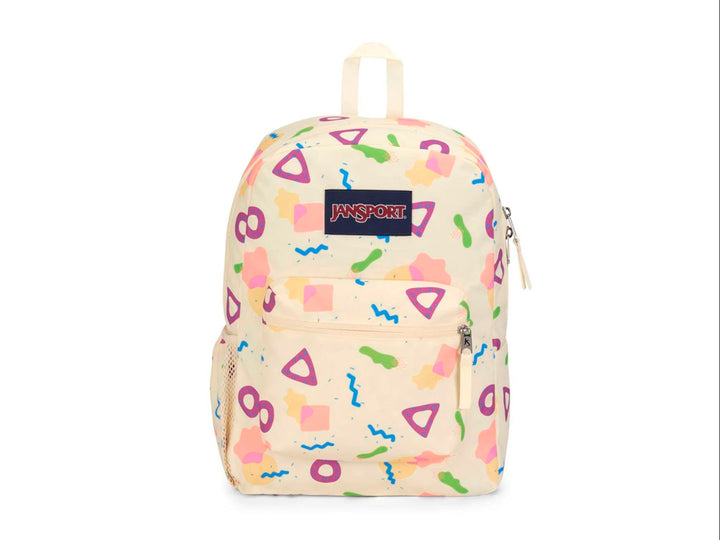 Mochila JanSport color beige con estampado de figuras geométricas en colores neón y logotipo frontal.