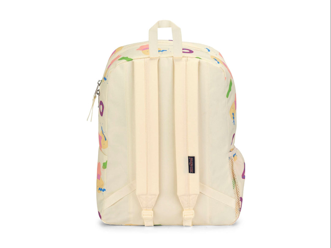 Mochila JanSport color beige con estampado de figuras geométricas en colores neón y logotipo frontal.
