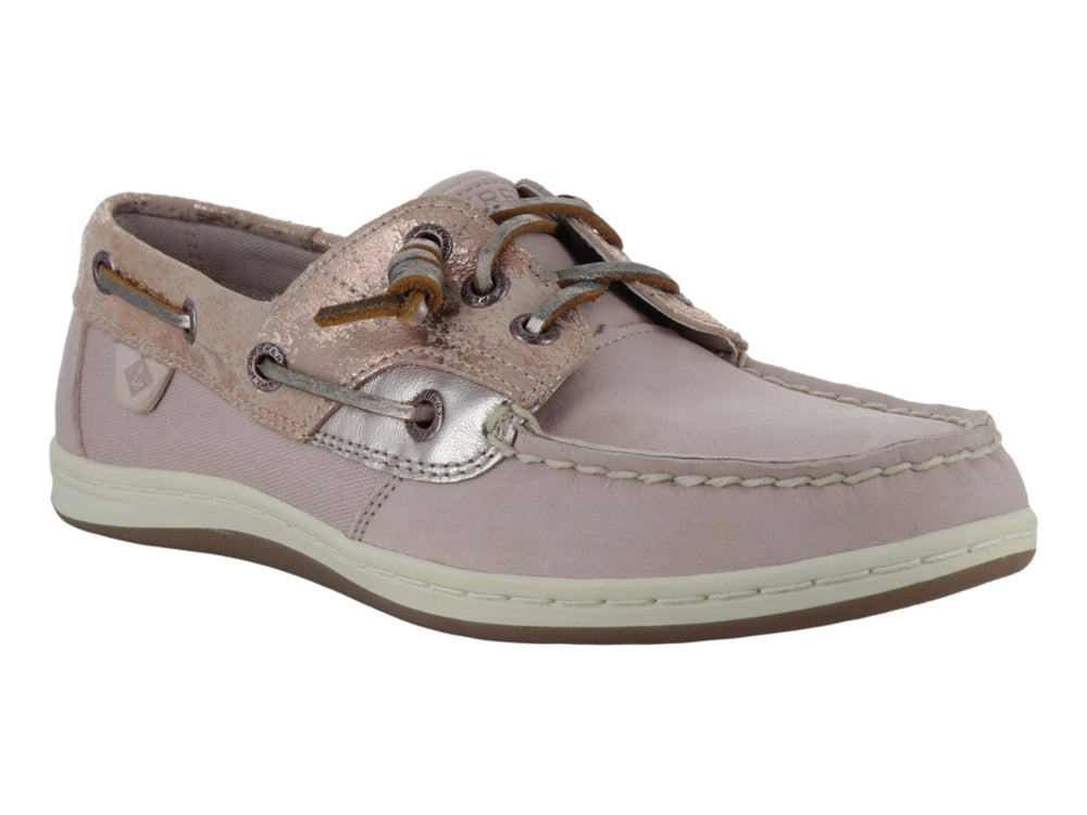 Zapato náutico Sperry color rosa con detalles metálicos plateados y suela blanca.
